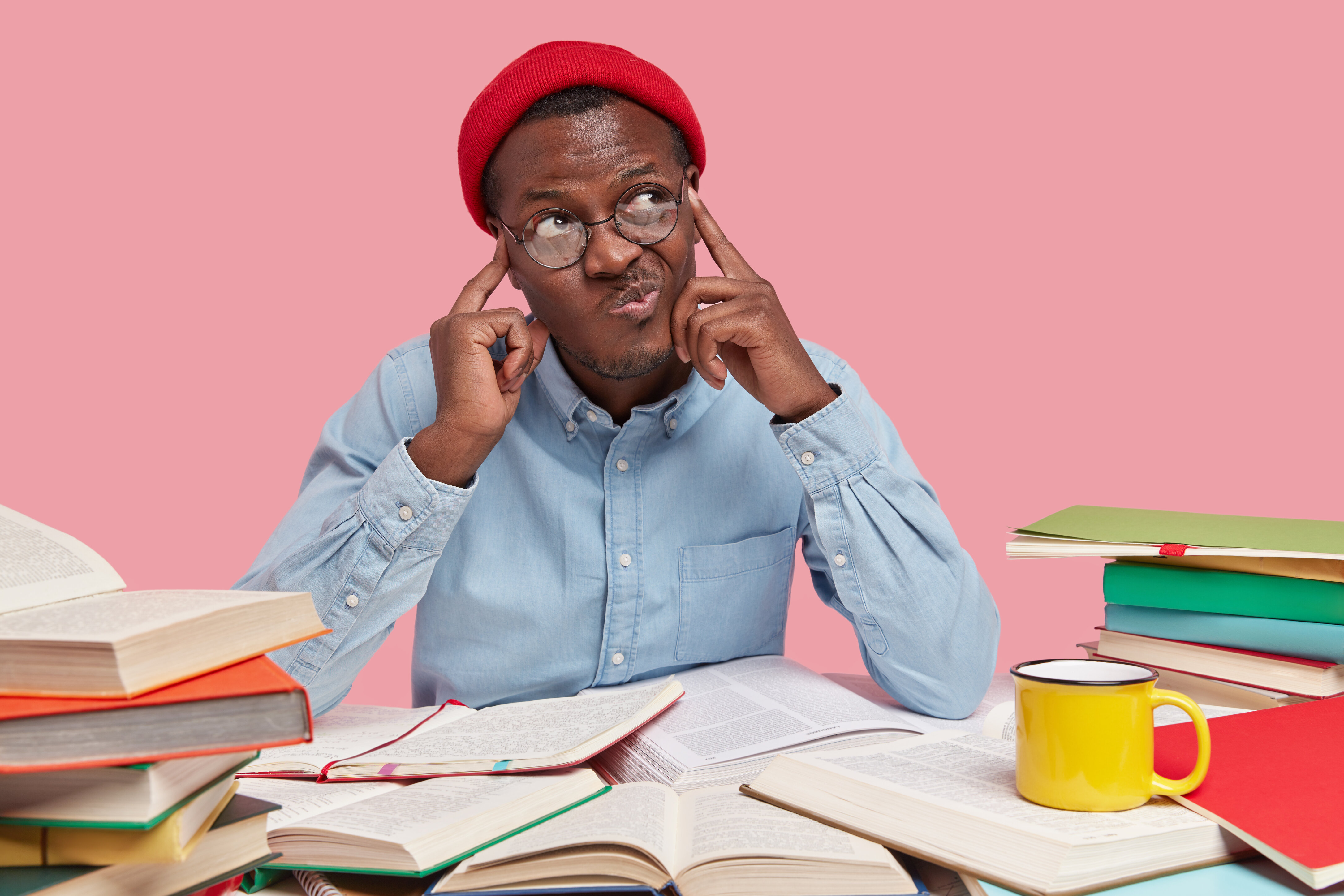 rsz_2contemplative-dark-skinned-college-student-keeps-both-fingers-temples-purses-lips-looks-with-hesitaton-aside-tries-analyze-information-his-mind-being-workaholic_1